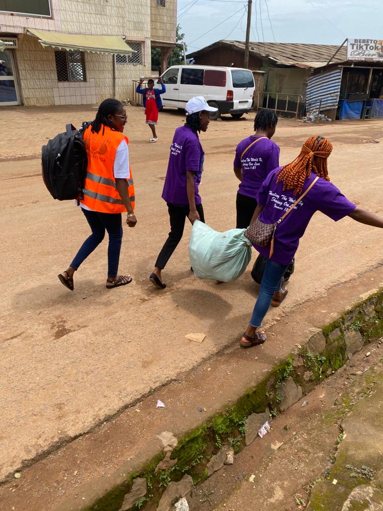 Smiles Africa volunteers bringing food supplies to needy widows in remote communities